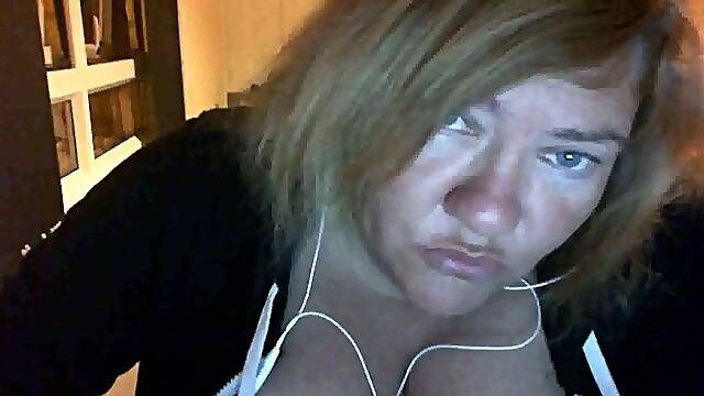 Ugly big boobed whore showing her bust on webcam session