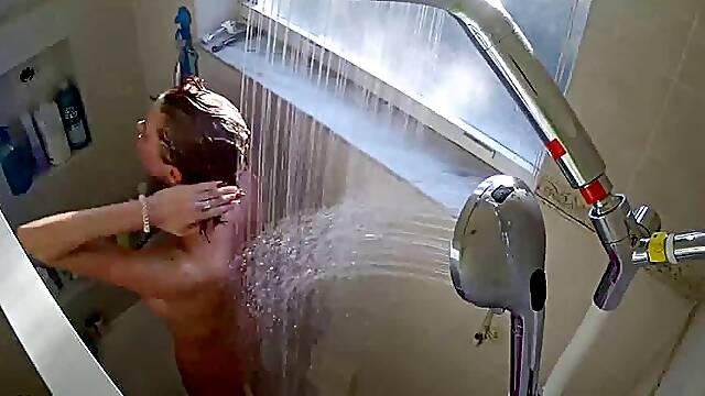 IPCAM – Busty American girl takes a long shower