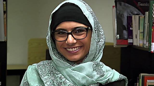 A naughty Arab girl gets naked and fingers in a public library