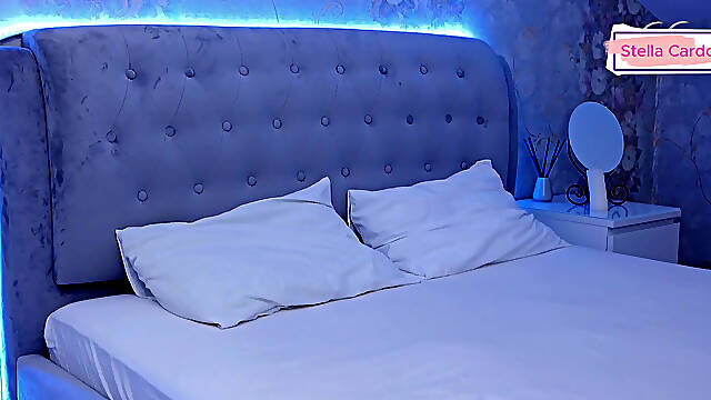 Pours oil on breasts for massage