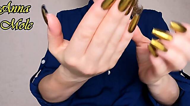Golden manicured hands of Anna Mole in a sexy finger fetish scene